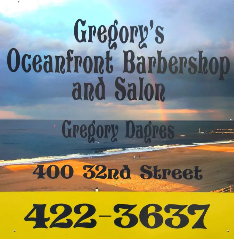 Their sign: the shop's name over the Virginia Beach surf at sunset, Gregory Dagres, 400 32nd Street, and 422-3637 on a yellow band